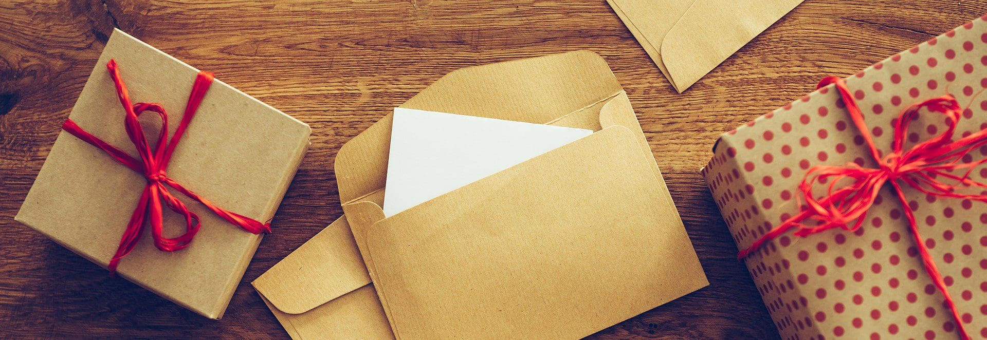 A brown envelope with a white paper in it.