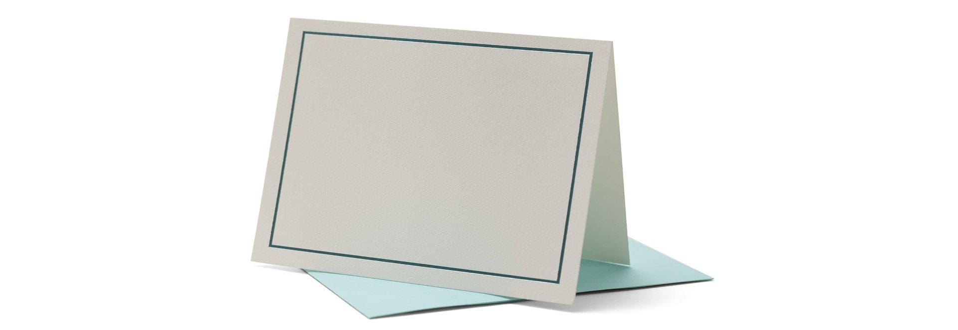 A white card with blue border on top of it.